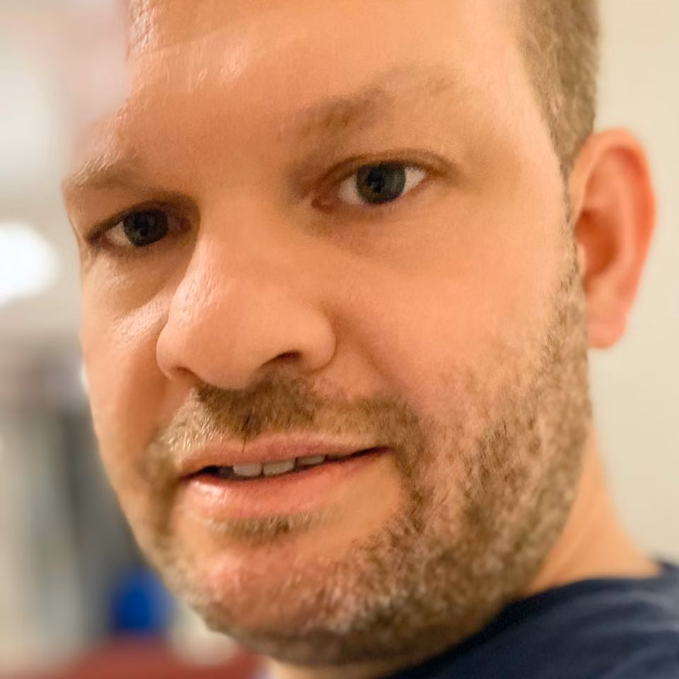 Michael Denyer looks to camera