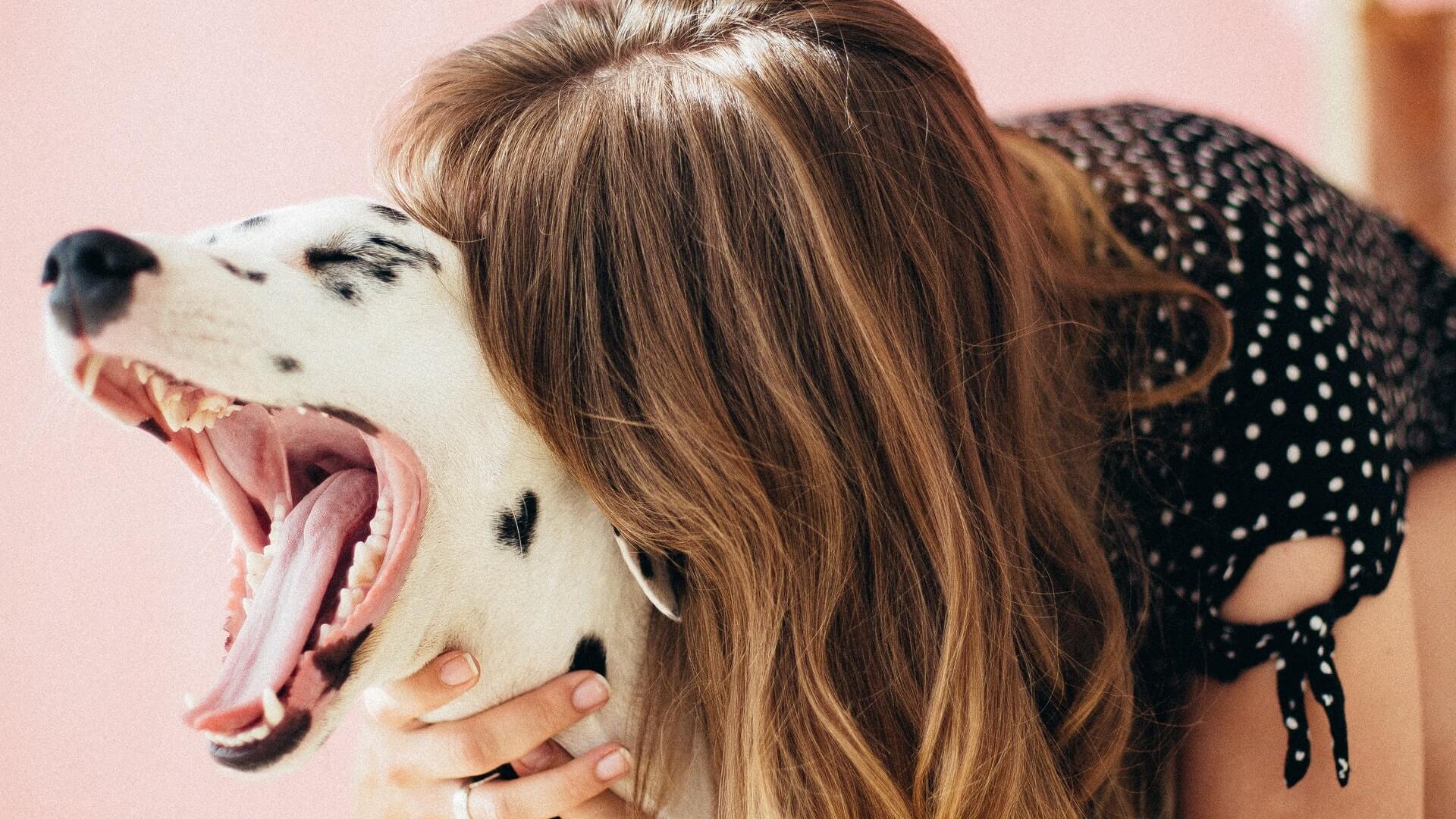 Woman loving on her dog